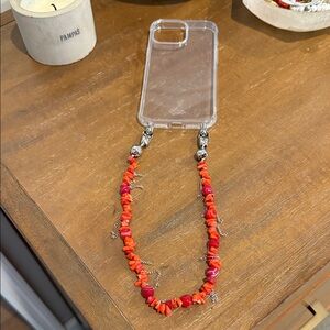 Ossa red rock and chain fringe wristlet